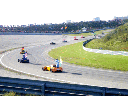 Old race cars with drivers and flags, before the Main Race of the 2007-08 Dutch A1 Grand Prix of Nations