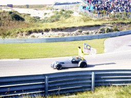 Old race car with Alex Yoong and the Malaysian flag at Circuit Zandvoort, before the Main Race of the 2007-08 Dutch A1 Grand Prix of Nations