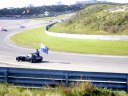 Old race cars with drivers and flags, before the Main Race of the 2007-08 Dutch A1 Grand Prix of Nations