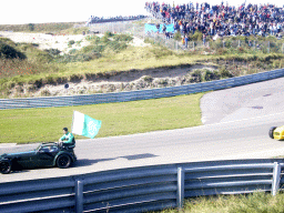 Old race car with Adam Langley-Khan and the Pakistani flag at Circuit Zandvoort, before the Main Race of the 2007-08 Dutch A1 Grand Prix of Nations