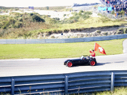 Old race car with Neel Jani and the Swiss flag at Circuit Zandvoort, before the Main Race of the 2007-08 Dutch A1 Grand Prix of Nations