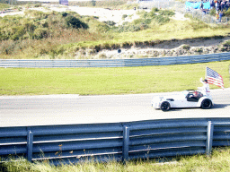 Old race car with Buddy Rice and the American flag at Circuit Zandvoort, before the Main Race of the 2007-08 Dutch A1 Grand Prix of Nations