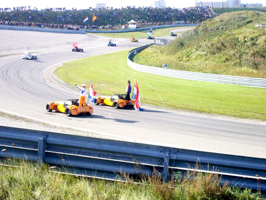 Old race cars with drivers and flags, before the Main Race of the 2007-08 Dutch A1 Grand Prix of Nations