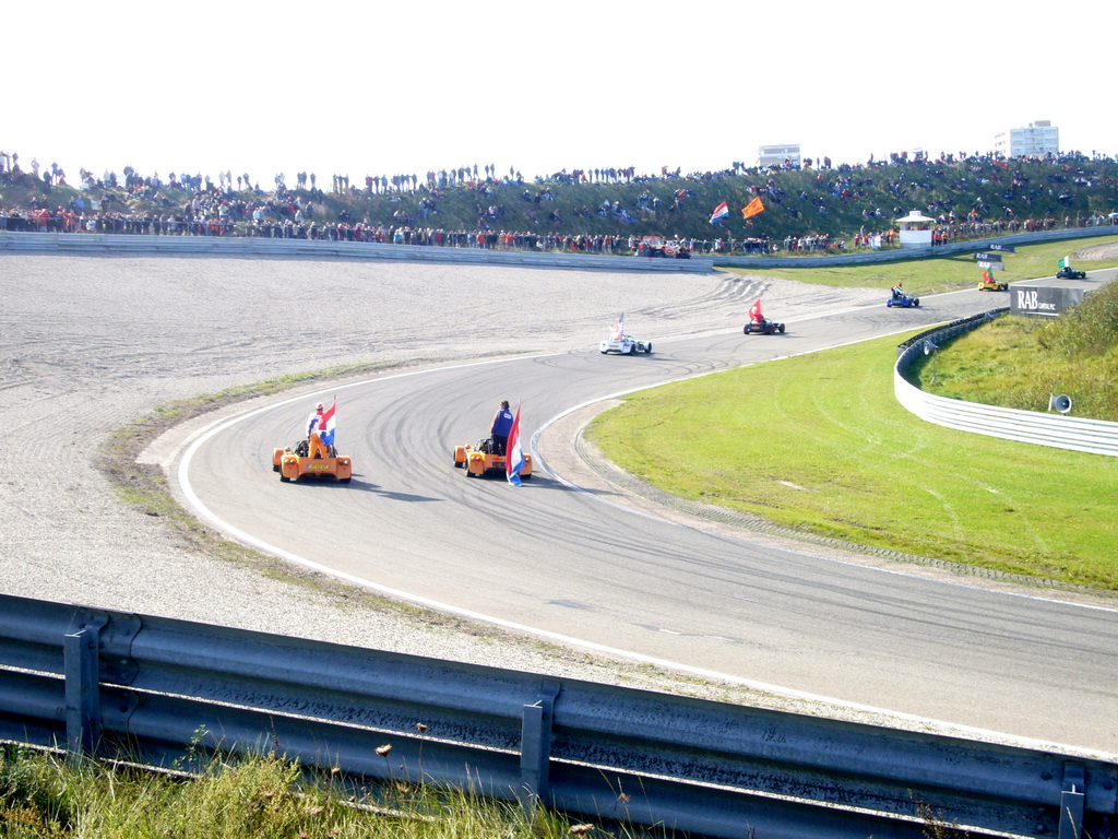 Old race cars with drivers and flags, before the Main Race of the 2007-08 Dutch A1 Grand Prix of Nations