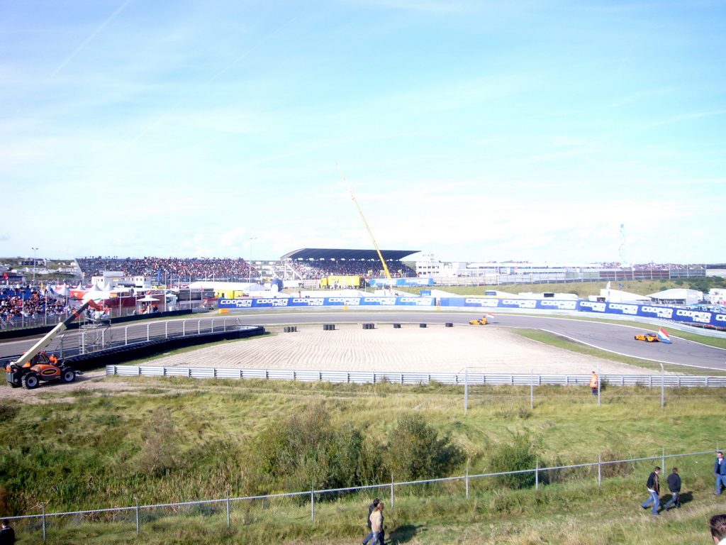 Old race cars with Jeroen Bleekemolen, another Dutch driver and Dutch flags at Circuit Zandvoort, before the Main Race of the 2007-08 Dutch A1 Grand Prix of Nations