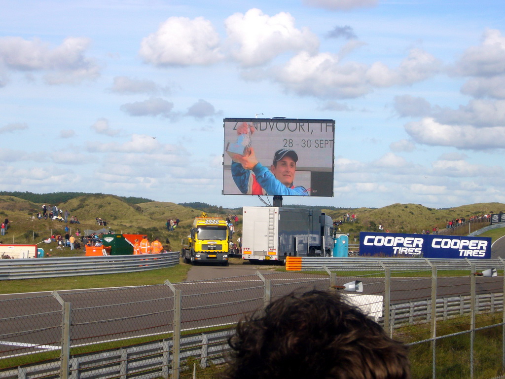 Screen with Oliver Jarvis lifting the cup at Circuit Zandvoort, just after winning the Main Race of the 2007-08 Dutch A1 Grand Prix of Nations