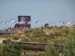 Fans on a dune with a skateboard track and the Eastside Grandstands at Circuit Zandvoort
