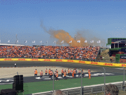 Stewards at the Hans Ernst Chicane and orange smoke at the Arena-In Grandstand 1 at Circuit Zandvoort, viewed from the Eastside Grandstand 3, during the Formula 1 Pre-Qualification Show