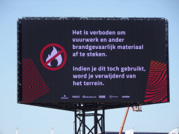 TV screen with message about fireworks at Circuit Zandvoort, viewed from the Eastside Grandstand 3, inbetween the during the Formula 1 Qualification Sessions 1 and 2