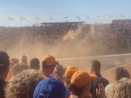 Orange smoke at the Hans Ernst Chicane at Circuit Zandvoort, viewed from the Eastside Grandstand 3, right after the Formula 1 Qualification Session 3