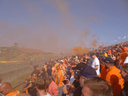 Orange smoke at the Eastside Grandstand 3 at Circuit Zandvoort, right after the Formula 1 Qualification Session 3