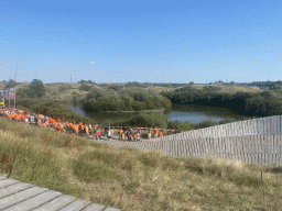 Fans walking along the pond and the Eastside Grandstands at Circuit Zandvoort