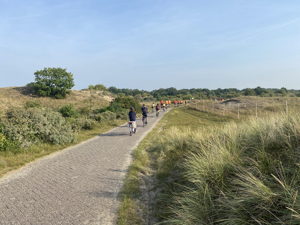 Fans biking on the Blinkertweg road through the dunes to the parking lots of Circuit Zandvoort