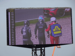 TV screen with Logan Sargeant walking away after an accident at Circuit Zandvoort, viewed from the Eastside Grandstand 3, during the Formula 2 Feature Race