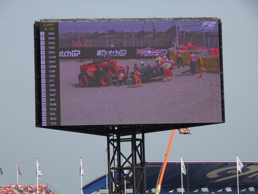 TV screen with the Formula 2 car of Logan Sargeant being dragged away after an accident at Circuit Zandvoort, viewed from the Eastside Grandstand 3, during the Formula 2 Feature Race