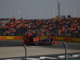 Formula 2 car of Logan Sargeant being driven away after an accident at the Hans Ernst Chicane at Circuit Zandvoort, viewed from the Eastside Grandstand 3, during the Formula 2 Feature Race