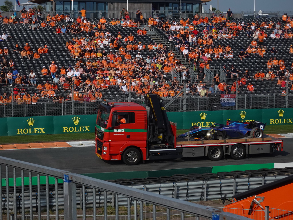 Formula 2 car of Logan Sargeant being driven away after an accident at the Hans Ernst Chicane at Circuit Zandvoort, viewed from the Eastside Grandstand 3, during the Formula 2 Feature Race