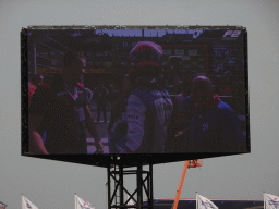 TV screen with Richard Verschoor at the main straight at Circuit Zandvoort, viewed from the Eastside Grandstand 3, right after the Formula 2 Feature Race