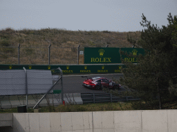 Porsche Mobil 1 Supercup car of Clément Mateu at the Arie Luyendyk corner at Circuit Zandvoort, viewed from near the tunnel under the road, during the Porsche Mobil 1 Supercup Race