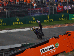Stuntman on a motorcycle at the Hans Ernst Chicane at Circuit Zandvoort, viewed from the Eastside Grandstand 3, during the Showteam Promotor Activity