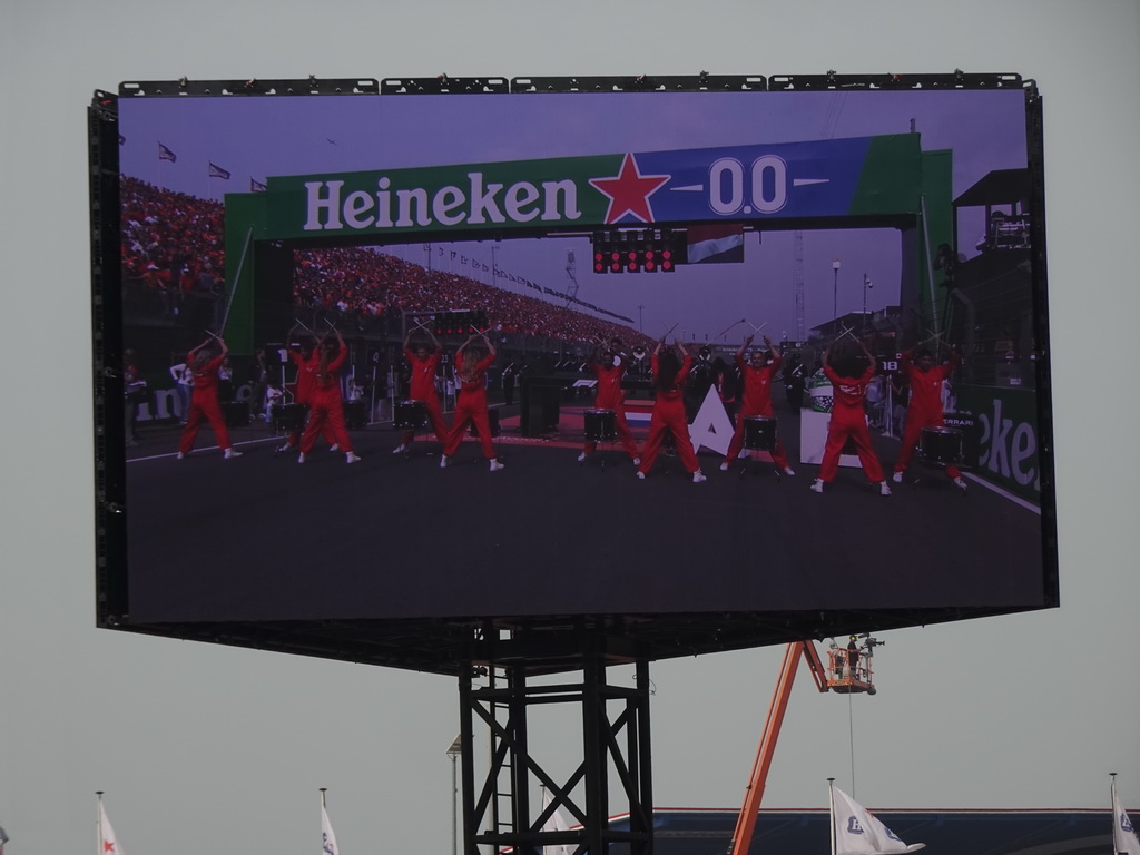 TV screen with drummers at the main straight at Circuit Zandvoort, viewed from the Eastside Grandstand 3, during the pre-race show of the Formula 1 Race