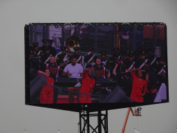 TV screen with Afrojack, DubVision, drummers and orchestra at the main straight at Circuit Zandvoort, viewed from the Eastside Grandstand 3, during the pre-race show of the Formula 1 Race