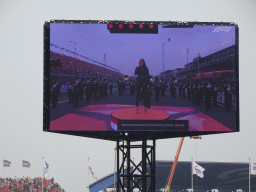 TV screen with Floor Jansen and orchestra performing the Dutch National Anthem at the main straight at Circuit Zandvoort, viewed from the Eastside Grandstand 3, during the pre-race show of the Formula 1 Race