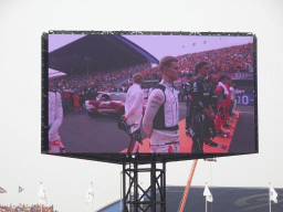 TV screen with Formula 1 drivers at the main straight at Circuit Zandvoort, viewed from the Eastside Grandstand 3, during the pre-race show of the Formula 1 Race