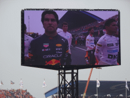 TV screen with Formula 1 drivers at the main straight at Circuit Zandvoort, viewed from the Eastside Grandstand 3, during the pre-race show of the Formula 1 Race