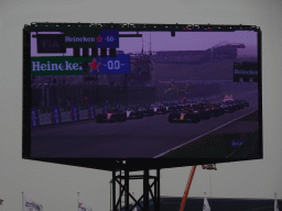 TV screen with all Formula 1 cars at the main straight at Circuit Zandvoort, viewed from the Eastside Grandstand 3, during the start of the Formula 1 Race