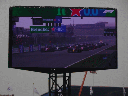 TV screen with all Formula 1 cars at the main straight at Circuit Zandvoort, viewed from the Eastside Grandstand 3, during the start of the Formula 1 Race