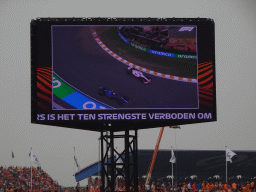 TV screen with the Formula 1 cars of Kevin Magnussen and Nicholas Latifi at Circuit Zandvoort, viewed from the Eastside Grandstand 3, during the Formula 1 Race
