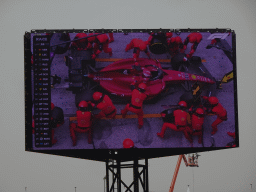 TV screen with the Formula 1 car of Charles Leclerc doing a pit stop at Circuit Zandvoort, viewed from the Eastside Grandstand 3, during the Formula 1 Race