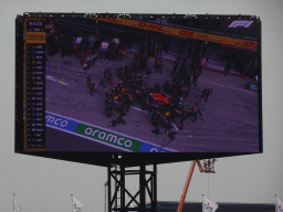 TV screen with the Formula 1 car of Max Verstappen doing a pit stop at Circuit Zandvoort, viewed from the Eastside Grandstand 3, during the Formula 1 Race