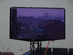 TV screen with the Formula 1 car of Max Verstappen crossing the finish line at the main straight at Circuit Zandvoort, viewed from the Eastside Grandstand 3, during the Formula 1 Race