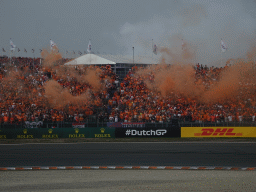 Orange smoke at the Hans Ernst Chicane at Circuit Zandvoort, viewed from the Eastside Grandstand 3, right after the Formula 1 Race