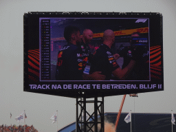 TV screen with Red Bull Racing mechanics at the pit straight at Circuit Zandvoort, viewed from the Eastside Grandstand 3, right after the Formula 1 Race