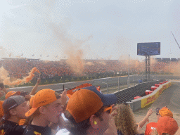 Orange smoke at the Hans Ernst Chicane at Circuit Zandvoort, viewed from the Eastside Grandstand 3, right after the Formula 1 Race