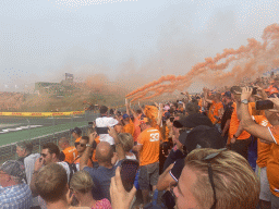 Orange smoke at the Eastside Grandstand 3 at Circuit Zandvoort, right after the Formula 1 Race