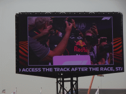 TV screen with Max Verstappen at the pit straight at Circuit Zandvoort, viewed from the Eastside Grandstand 3, right after the Formula 1 Race