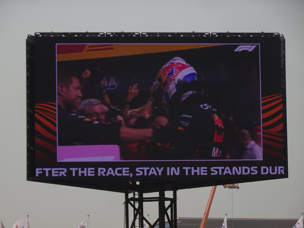 TV screen with Max Verstappen at the pit straight at Circuit Zandvoort, viewed from the Eastside Grandstand 3, right after the Formula 1 Race