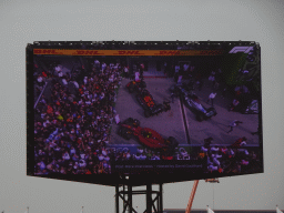 TV screen with the Formula 1 cars of Max Verstappen, George Russell and Charles Leclerc at the pit straight at Circuit Zandvoort, viewed from the Eastside Grandstand 3, right after the Formula 1 Race