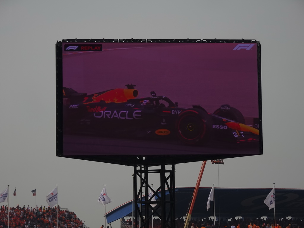 TV screen with the Formula 1 car of Max Verstappen at Circuit Zandvoort, viewed from the Eastside Grandstand 3, right after the Formula 1 Race