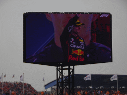 TV screen with Max Verstappen at the main stage at Circuit Zandvoort, viewed from the Eastside Grandstand 3, during the podium ceremony of the Formula 1 Race