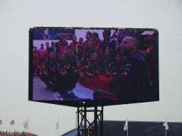 TV screen with Red Bull Racing mechanics at the pit straight at Circuit Zandvoort, viewed from the Eastside Grandstand 3, during the podium ceremony of the Formula 1 Race