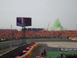 Green smoke at the Hans Ernst Chicane at Circuit Zandvoort, viewed from the Eastside Grandstand 3, during the podium ceremony of the Formula 1 Race