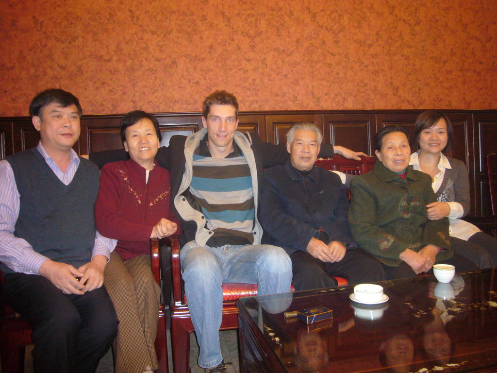 Tim, Miaomiao and Miaomiao`s parents and grandparents in a restaurant in the city center