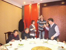Tim, Miaomiao and Miaomiao`s parents and grandparents having drinks in a restaurant in the city center