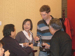 Tim, Miaomiao and Miaomiao`s grandparents having drinks in a restaurant in the city center