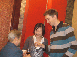 Tim, Miaomiao and a family member having drinks in a restaurant in the city center